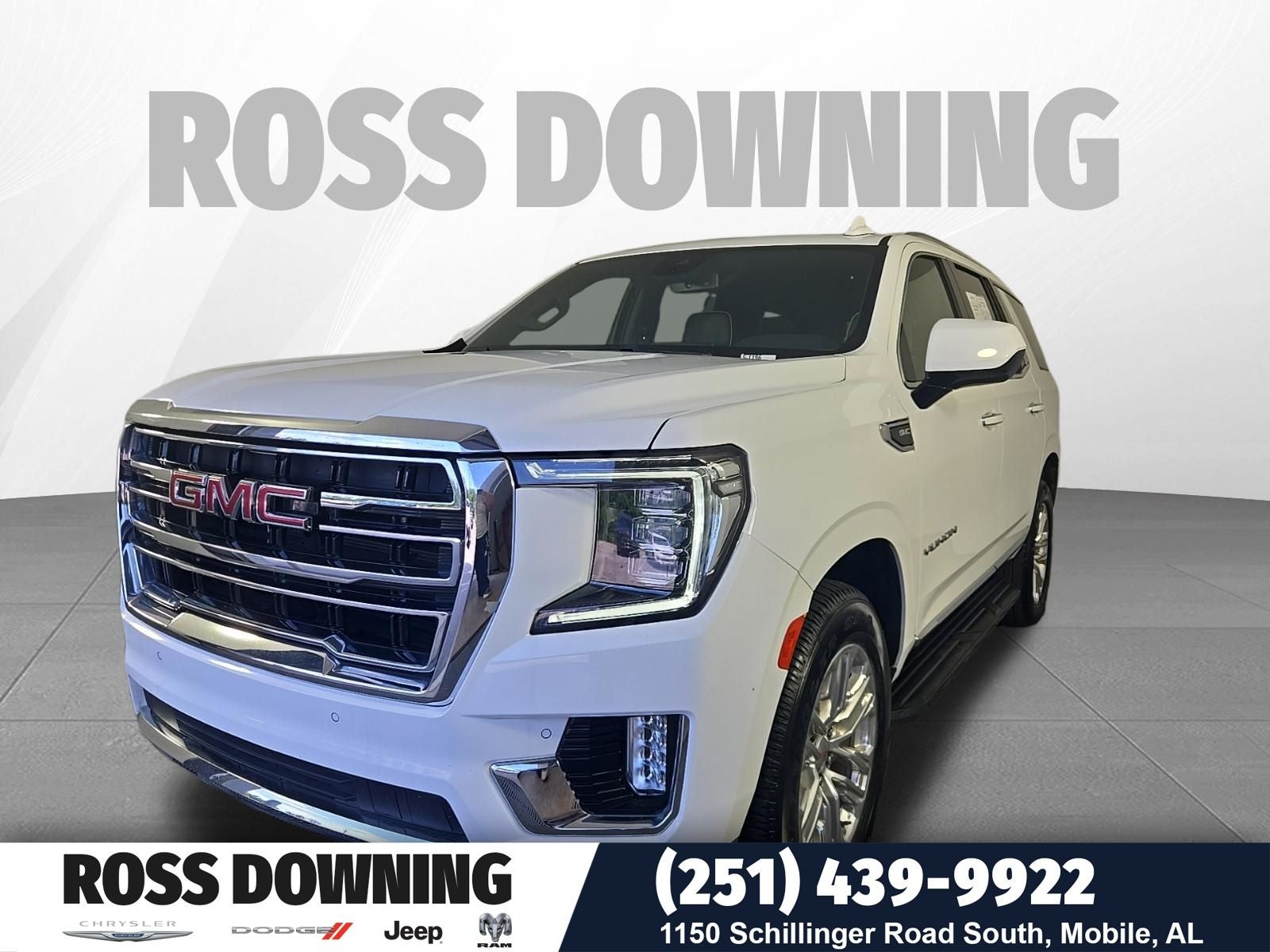2024 GMC Yukon SLT in Summit White — front three-quarter view
