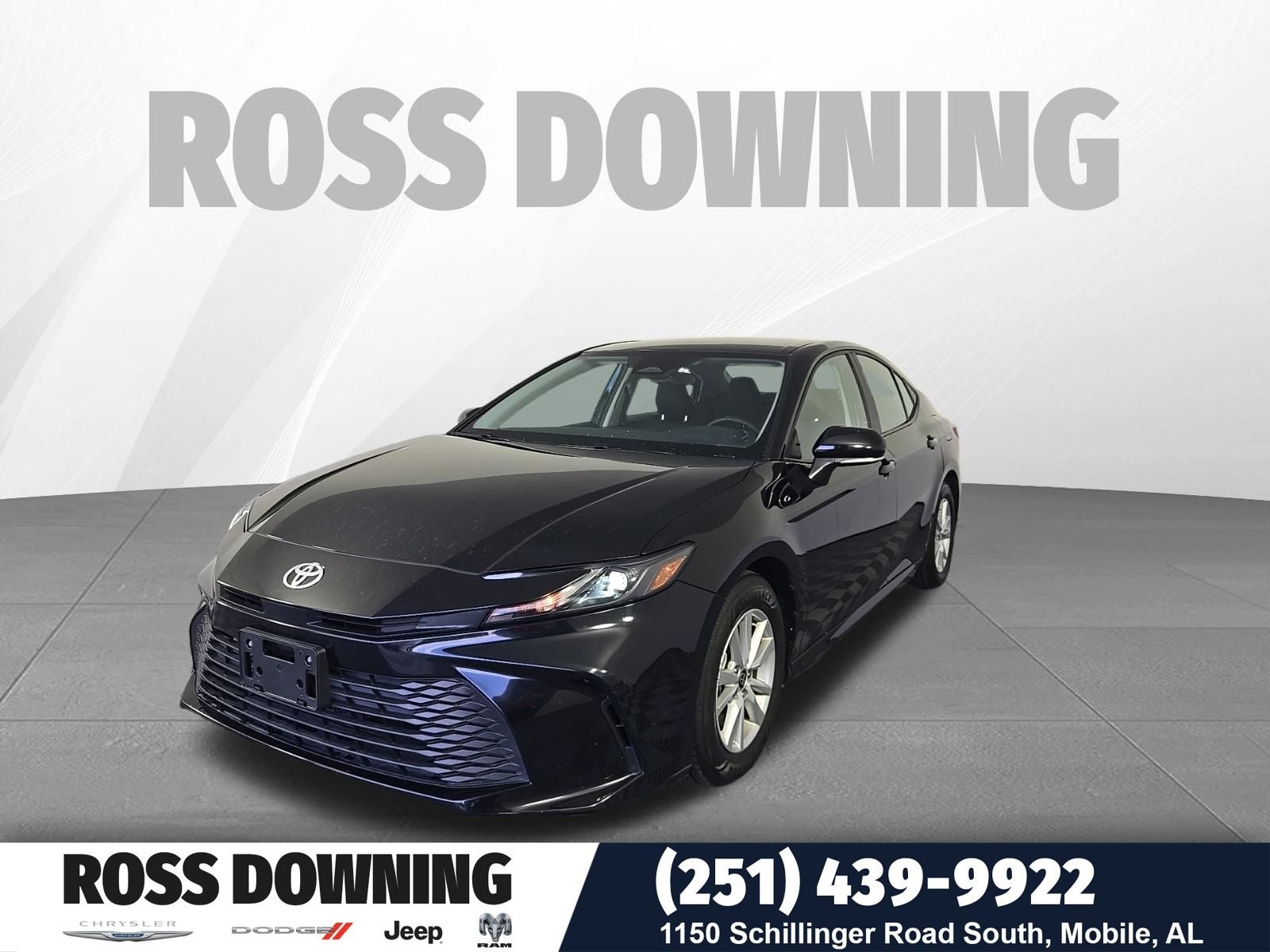 2025 Toyota Camry LE in Midnight Black Metallic — front three-quarter view